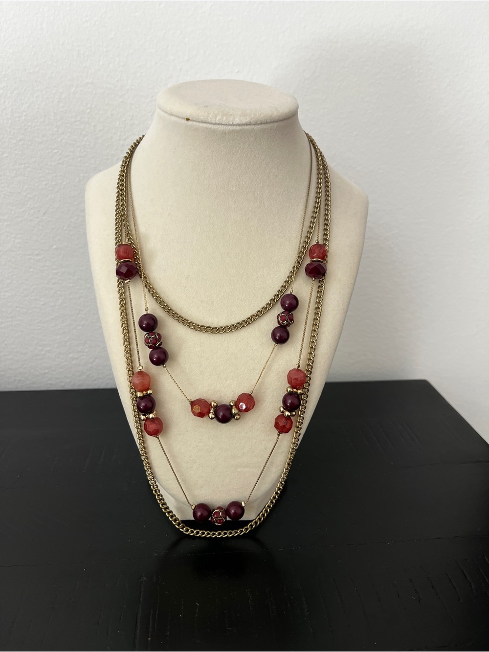 Multi-strand gold and purple beaded necklace